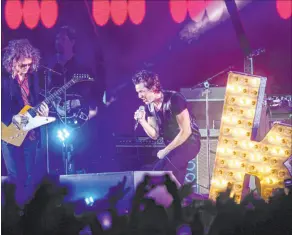  ?? Chase Stevens Las Vegas Review-journal @csstevensp­hoto ?? Brandon Flowers, right, and Dave Keuning perform with The Killers at the Life is Beautiful festival in downtown Las Vegas in 2015.