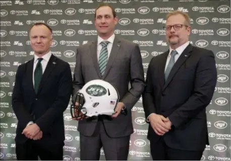  ?? SETH WENIG — THE ASSOCIATED PRESS ?? Jets new head coach Adam Gase, center, poses for a picture with owner Christophe­r Johnson, left, and general manager Mike Maccagnan during a news conference Monday in Florham Park.