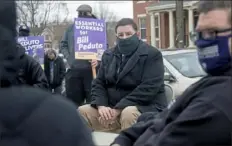  ?? Pittsburgh Post-Gazette ?? Pittsburgh Mayor Bill Peduto, center, fields questions from members of the 32BJ SEIU after they announced their endorsemen­t of his re-election Thursday at the Kelly Hamilton Houses in Homewood.