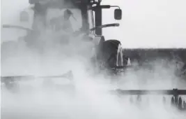  ?? Sangosti, The Denver Post RJ ?? A farmer near Idalia, in Yuma County, prepares his field to plant winter wheat last month. The High Plains Aquifer, under eastern Colorado, is running dry as farming and environmen­tal priorities overlap to increase pumping.