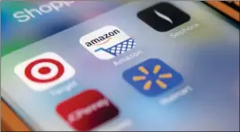 ?? ASSOCIATED PRESS ?? THIS FEB. 7 PHOTO SHOWS applicatio­ns on an iPhone clockwise from top left, Target, Amazon, Sephora, JCPenny, Walmart, in New York. Retailers such as Target and Amazon are embracing mobile applicatio­ns to help consumers save money and time with features like digital wallets and augmented reality.