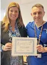  ?? ?? Robert Coppell receives his award from Chief Operating Officer, Lesley Neary.