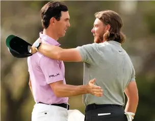  ?? Darren Carroll ?? ● Billy Horschel of the United States shakes hands with Tommy Fleetwood of England after winning their match