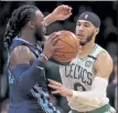  ?? AP ?? Celtics forward Jayson Tatum pressures Memphis Grizzlies forward Jae Crowder during the second half of Wednesday night’s win in Boston.