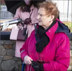  ??  ?? Marie Malone says a decade of the rosary at Sunday’s ceremony.