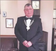  ??  ?? Cllr Timmy Collins proudly wearing the deputy county mayor chain of office - an achievemen­t he described as the “highpoint” of his political career.