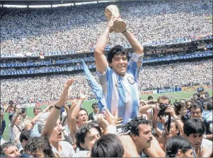  ?? AP PHOTO ?? In this June 29, 1986, file photo, Diego Maradona, holds up the trophy, after Argentina beat West Germany 3-2 in the World Cup soccer final match, at the Atzeca Stadium, in Mexico City. The 21st World Cup begins on Thursday, when host Russia takes on...