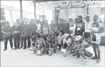  ?? ?? The overall winners in the Jagan’s Memorial Cycling Road Race (Berbice Leg) pose with their spoils alongside tournament officials and sponsors. (Photo: Michelange­lo Jacobus)
