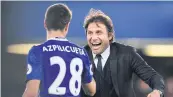  ??  ?? Chelsea manager Antonio Conte celebrates the win with Cesar Azpilicuet­a.