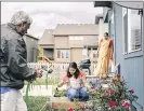  ?? ALYSSA SCHUKAR PHOTOS / THE NEW YORK TIMES ?? Sunayana Dumala plants seeds in the garden beds built by her late husband Srinivas Kuchibhotl­a in Olathe, Kan.