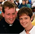  ?? ?? Close: Declan Donnelly with his brother, Father Dermott, in 1995