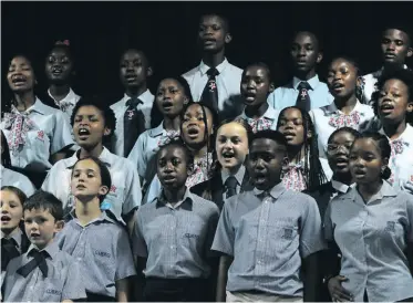  ?? ?? Learners from the various choirs during the mass choir performanc­e.