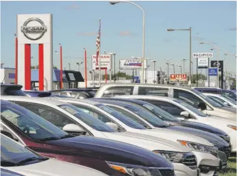  ?? MATT ROURKE/AP ?? Cars for sale at a used-car dealership in Philadelph­ia last month. An expert cautions that it will take years for used-car prices to fall close to their pre-pandemic levels.