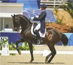  ?? ?? Anna Marek (USA) and Fire Fly win individual bronze in dressage.