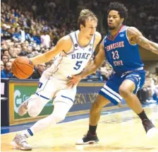  ?? THE ASSOCIATED PRESS ?? Duke's Luke Kennard (5) drives as Tennessee State's A'Torey Everett (23) defends during Monday's game in Durham, N.C.