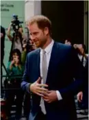  ?? CARL COURT/GETTY IMAGES ?? Harry, Duke of Sussex, left after giving testimony at the Mirror Group phone hacking trial on Wednesday in London.