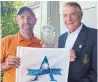  ??  ?? Worden Teasdale, right, presents his namesake trophy to Star Am senior champion Doug McNeil on Tuesday.