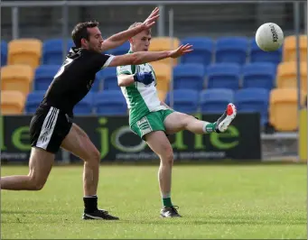  ??  ?? Chris Heaslip of Baltinglas­s gets this shot away as Newtown’s John O’Donohoe tries to block.