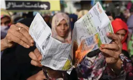  ?? Photograph: Shahzaib Akber/EPA ?? An electricit­y bill is burned during a protest in Karachi last week against rising living costs.