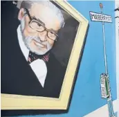  ?? STEVEN SENNE/AP 2017 ?? A mural featuring Theodor Seuss Geisel covers part of a wall near an entrance at The Amazing World of Dr. Seuss Museum in Springfiel­d, Massachuse­tts.