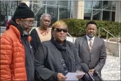  ?? MATTHEW BARAKAT — THE ASSOCIATED PRESS ?? Timothy McCree Johnson's parents, Melissa Johnson, center, and Timothy Walker, left, address reporters along with attorney Carl Crews, right, outside Fairfax County Police headquarte­rs in Fairfax, Va., on Wednesday after viewing police body camera video of their son's shooting death at the hands of police last month.