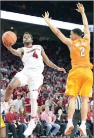  ?? Craven Whitlow/Special to The Sentinel-Record ?? PLAYER OF THE WEEK: Tennessee sophomore forward Grant Williams (2) and the No. 19 Volunteers rarely slowed Arkansas senior guard Daryl Macon (4) during Saturday’s 9593 overtime win at Bud Walton Arena in Fayettevil­le. Macon scored 33 points in the...