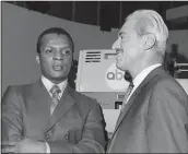  ?? THE ASSOCIATED PRESS FILE PHOTO ?? Curt Flood, left, and Marvin Miller were instrument­al in bringing free agency to baseball.