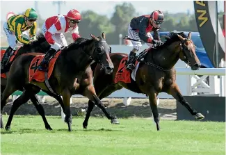  ?? PHOTO: TRISH DUNELL ?? Xbox, inner, holds off Mongolianc­onqueror and Time Lord in the Waikato Guineas at Te Rapa, yesterday.