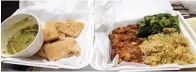  ?? Staff photo by Junius Stone ?? ■ The takeout box is even more familiar now as customers maintain social distancing with restaurant staff when picking up orders, such as this chicken-fried steak dinner from Hopkins Icehouse in downtown Texarkana.