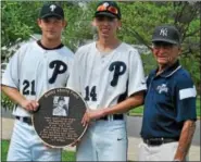  ??  ?? Pottstown great Bobby Shantz, right, is presented with a commemorat­ive plaque by current Trojans players Ron Fausnaught and Nate Camacho prior to the game.