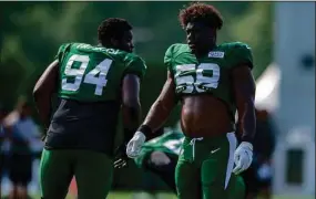  ?? John Jones / Icon Sportswire via Getty Images ?? Jets DE Carl Lawson (58) takes a break during training camp last year.