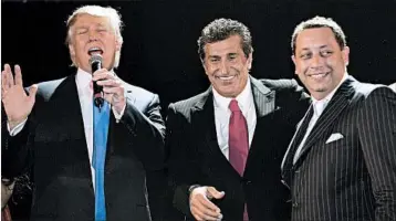  ?? MARK VON HOLDEN/WIREIMAGE ?? Donald Trump, from left, Bayrock founder Tevfik Arif and Felix Sater attend a Trump Soho hotel launch party in 2007.