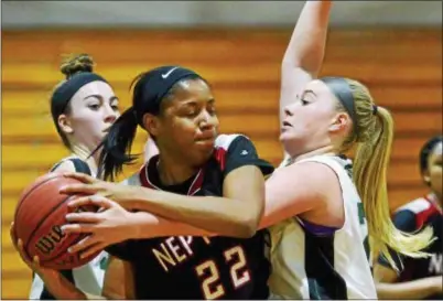  ?? KYLE FRANKO — TRENTONIAN PHOTO ?? Neptune’s Macy Brackett, center, looks to pass the ball as she’s defended by Steinert’s Jordan Jones, right, during a Central Jersey Group III game on Wednesday night.