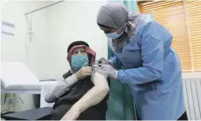  ?? EPA ?? A man receives a dose of a Covid-19 vaccine in Amman