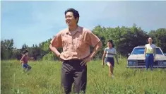  ?? A24 ?? Steven Yeun, foreground, stars in Lee Isaac Chung’s moving family drama as a Korean American dad and farmer who moves his clan from California to Arkansas to seek out his American dream.