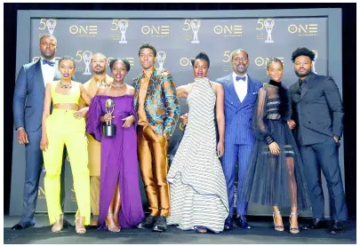  ?? AP PHOTOS ?? The cast of ‘Black Panther’ pose in the press room with the award for Outstandin­g Motion Picture at the 50th annual NAACP Image Awards on Saturday.