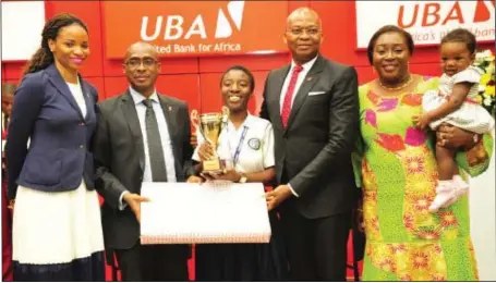  ??  ?? Managing Director, UBA Foundation, Ms. Ijeoma Aso; Executive Director, Operations and Technology, UBA Plc, Mr. Chukwuma Nweke, winner of 2016 UBA Foundation National Essay Competitio­n and student of Loyola Jesuit College, Abuja, Miss Felicia Amanosi...