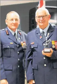  ??  ?? Excellence Award recipient was Operationa­l Support Firefighte­r Ken Callander (right), pictured with Chief Fire Officer Ian Campbell.