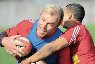  ?? Picture: GRANT PITCHER, GALLO IMAGES ?? LOOK WHO’S BACK: Schalk Burger gets tackled by Cheslin Kolbe during Western Province practice in Bellville yesterday. Burger could soon be back playing for WP in the Currie Cup.