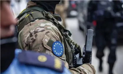  ??  ?? EU police during the arrest of an official from the KLA veterans’ associatio­n in Pristina last week. Photograph: Ferdi Limani/Getty Images