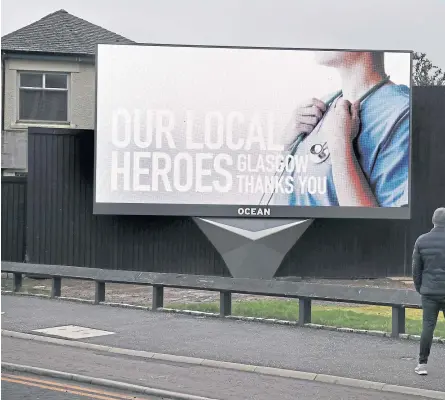  ?? Pictures: PA/SNS. ?? Clockwise from below: A police checkpoint in York; a billboard in Glasgow shows a message thanking NHS staff; police officers patrol a deserted Buchanan Street in Glasgow.