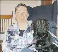  ?? LyNN CurwIN/Truro DaIly News ?? Stacey McNutt Lindsay adopted Timber from the Kings County SPCA. After she suffered a head injury the dog became a service animal who has given her back her independen­ce.