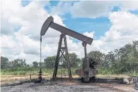  ?? BLOOMBERG FILE PHOTO ?? OPEC said total global oil supply had decreased by 1.09 million barrels a day in January to average 99.32 million barrels a day.