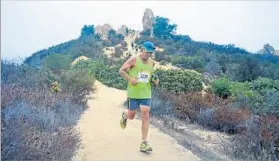  ?? Bulldog 50K Ultra Run and 25K Trail Run ?? DOGGED RUNNERS Iliana Alvarado, left, and writer David Leon Moore are seen testing themselves in last year’s 25k Bulldog Trail Run in Malibu Creek State Park.