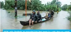  ?? — AFP ?? KOCHI, India: Residents are evacuated from their homes to a safer place on a wooden boat in the Indian state of Kerala yesterday.