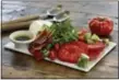  ?? THE ASSOCIATED PRESS ?? This May 23, 2016 photo shows a caprese salad with crispy prosciutto, from a cookbook by swimsuit model Chrissy Teigen and styled by Sarah Abrams.