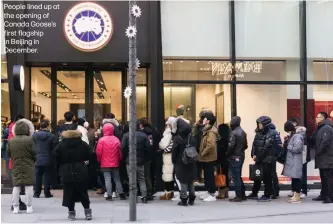 ??  ?? People lined up at the opening of Canada Goose’s first flagship in Beijing in December.