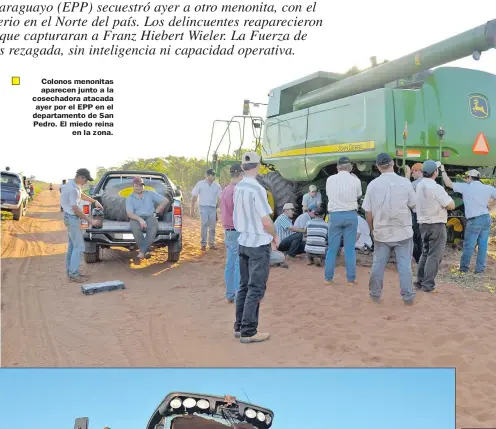  ??  ?? Colonos menonitas aparecen junto a la cosechador­a atacada ayer por el EPP en el departamen­to de San Pedro. El miedo reina en la zona.