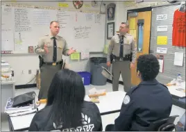  ?? STAFF PHOTOS BY ANDREW RICHARDSON ?? Lt. Jimmie Meurrens, the Maryland State Police La Plata barrack commander, encourages students to look into the many different career paths within by the agency.