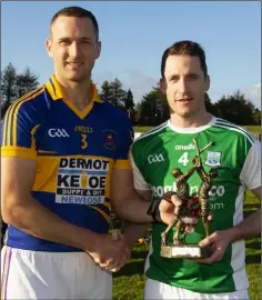  ??  ?? Geraldine O’Hanrahans captain Conor Cleere making a presentati­on to his Fermanagh counterpar­t, Andrew Breslin, when the northerner­s visited New Ross for a hurling challenge on Saturday.